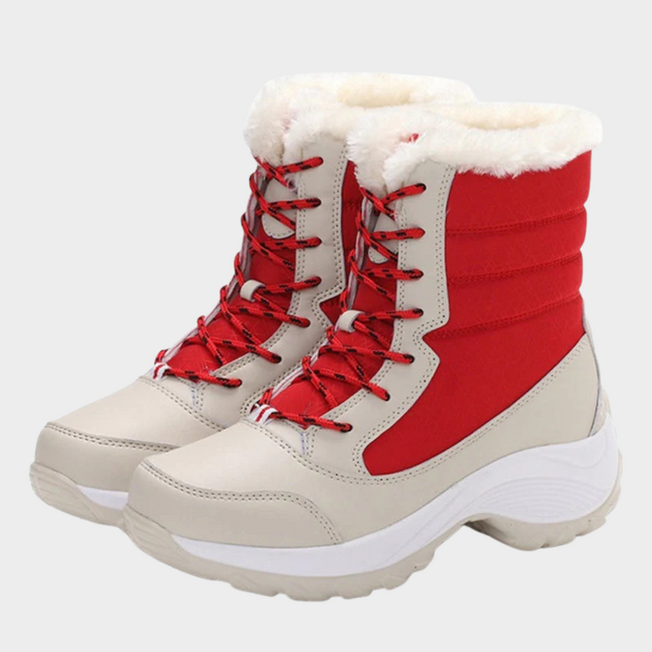 Red and cream winter boots with lace-up front and white faux-fur cuff on chunky sole.