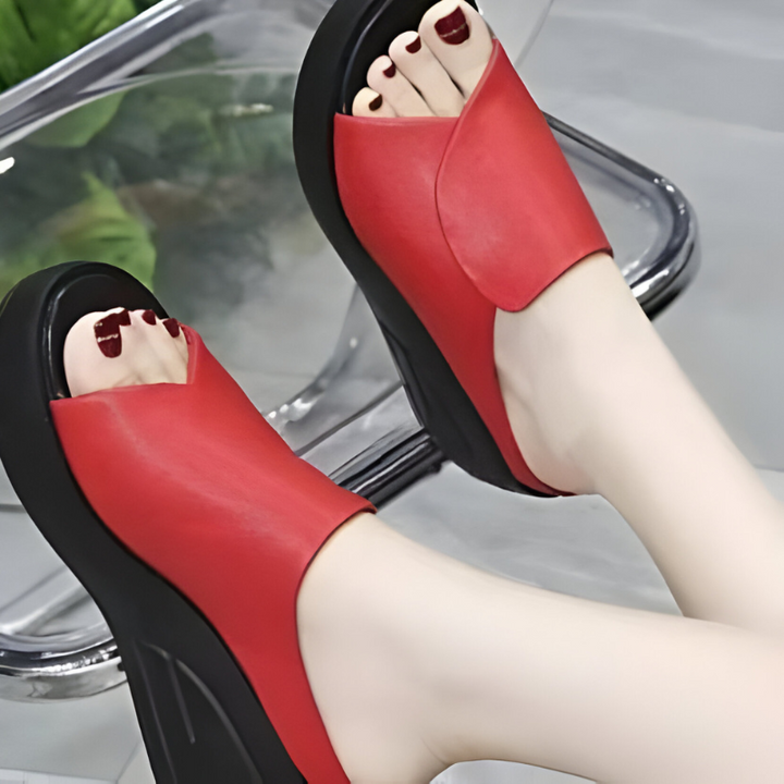 Red orthopedic sandals with open toe, wide strap, thick platform sole