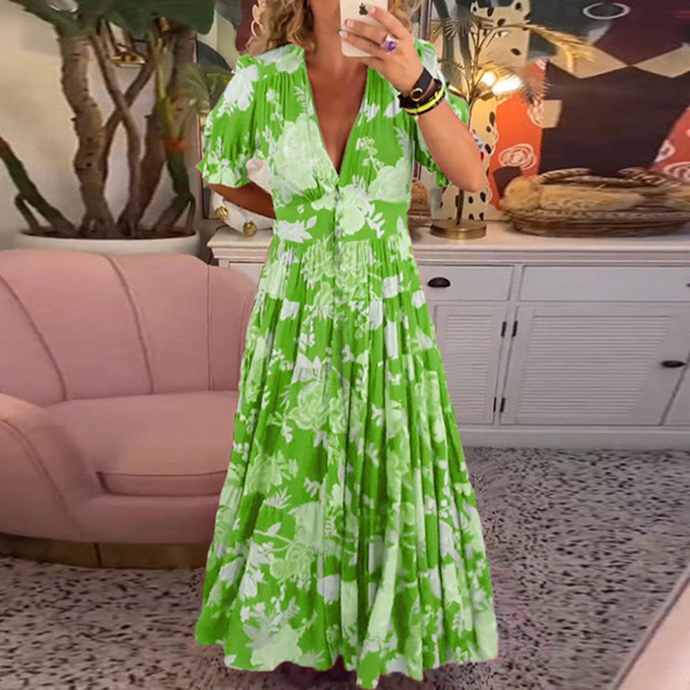 Floral maxi dress in bright green with white flower print, V-neck and tiered skirt, puff sleeves