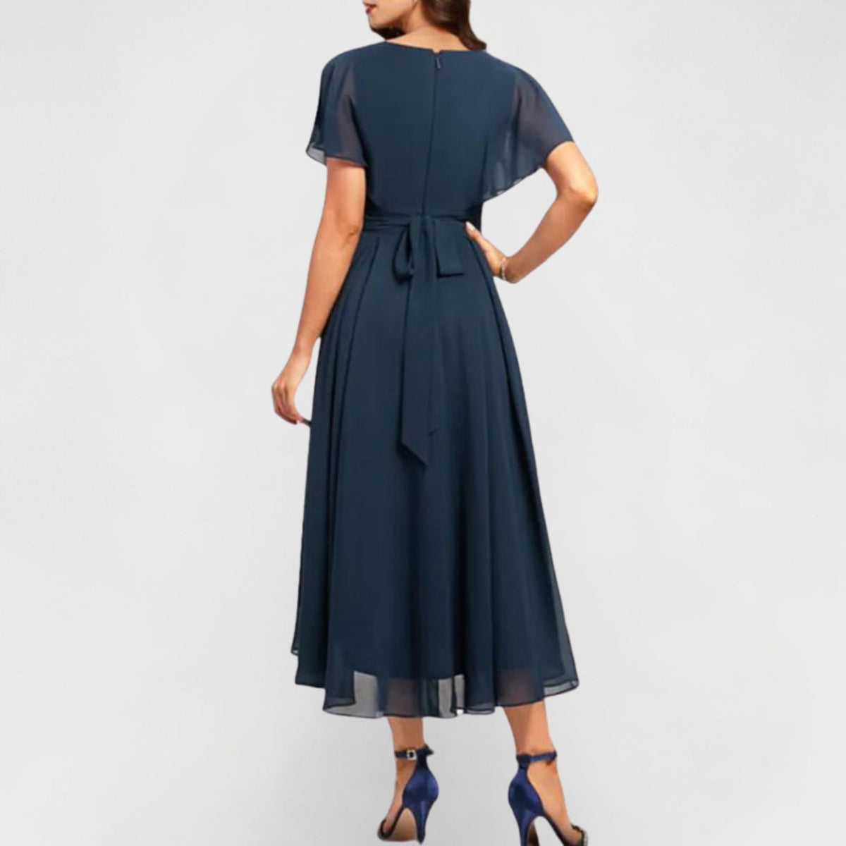Navy V-neck maxi dress back view with short flutter sleeves and tied waist detail