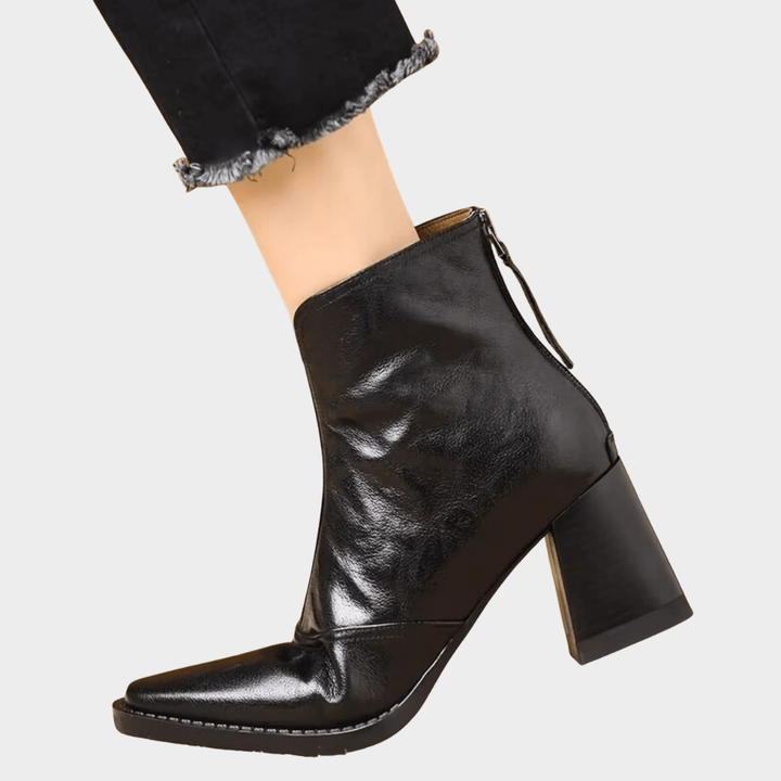 Black heeled ankle boots with side zipper pull and block heel