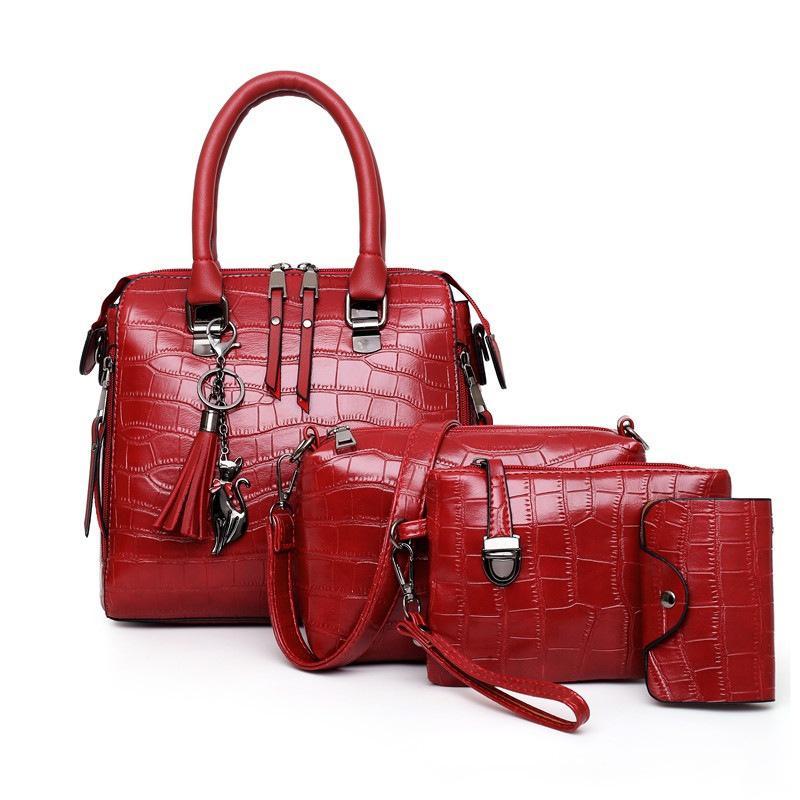 Red croc-pattern 4-piece handbag set with top handle, shoulder strap, and wallet pouch