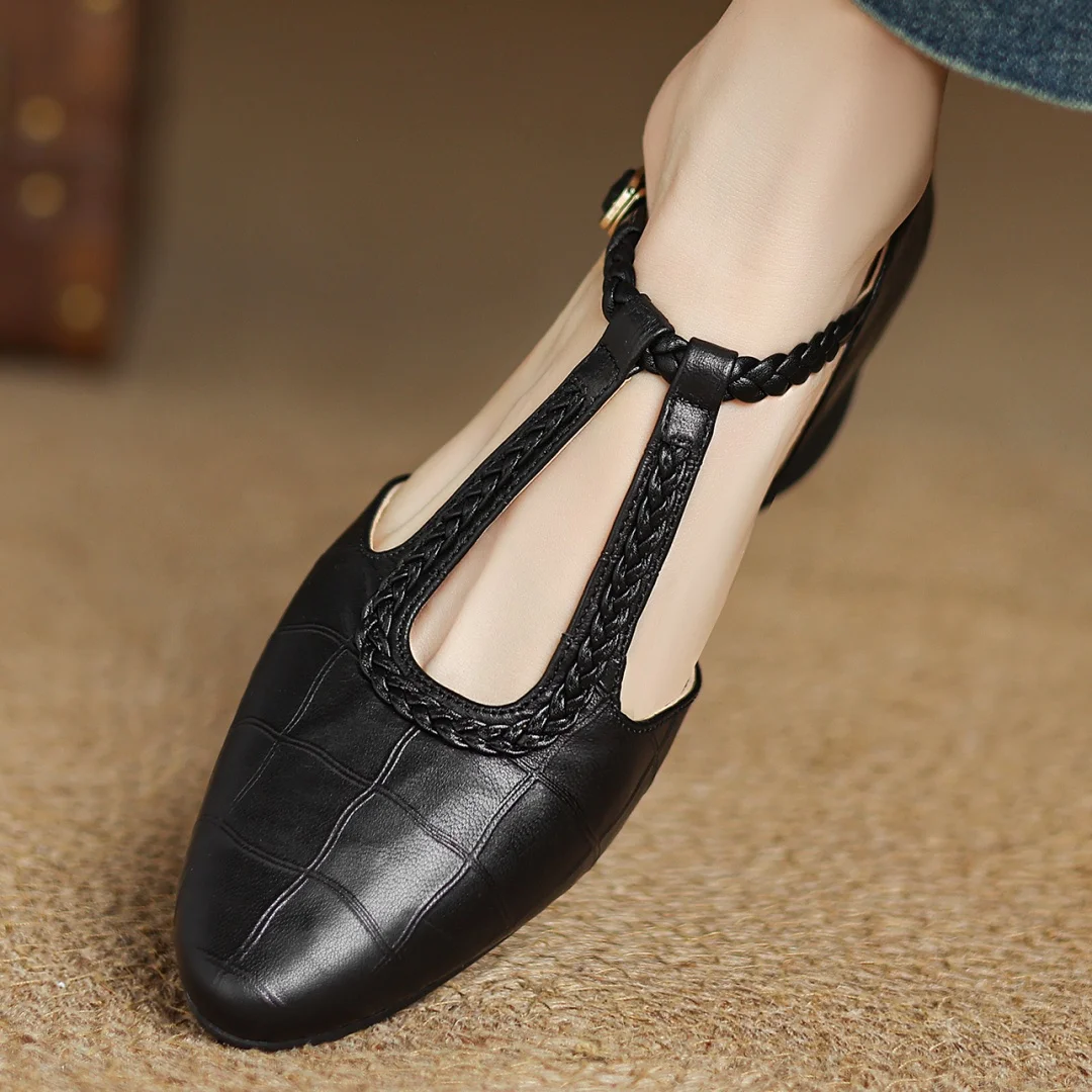 Black leather Mary Jane with braided edge trim around the open toe cutout