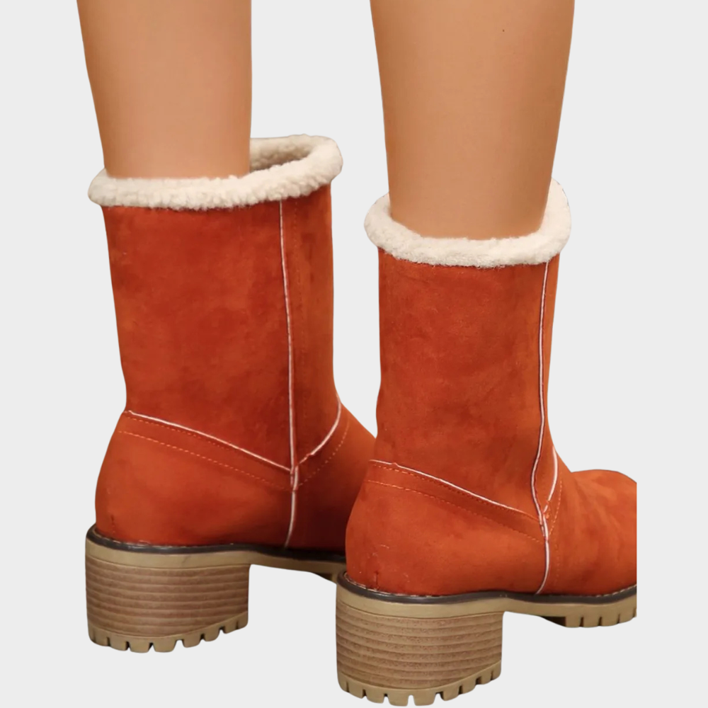 Orange suede pull-on winter boots with faux-sherpa lining at collar and stacked block heel