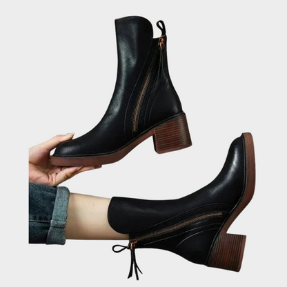 Black leather ankle heeled boots with side zip and tassel pull, block heel