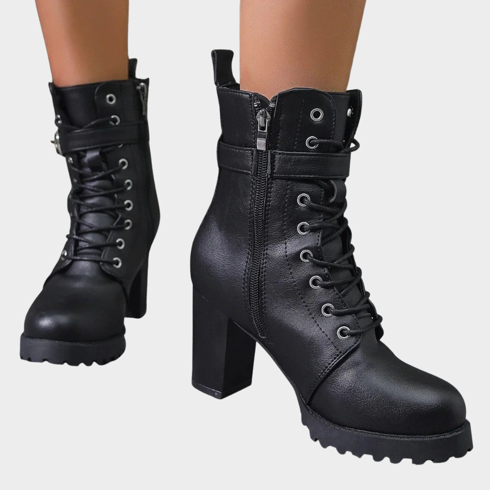 Black flared heel ankle boots with lace-up front, side zip, and chunky tread sole
