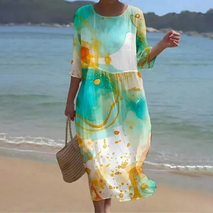 Teal and white midi dress with abstract pattern, three-quarter sleeves, loose fit