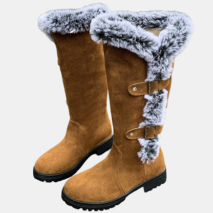Light brown mid-calf boots with light blue faux-fur top cuff and two buckle straps
