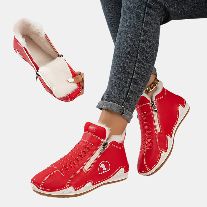 Red ergonomic boots with side zipper, lace-up details, and white faux-fur lining
