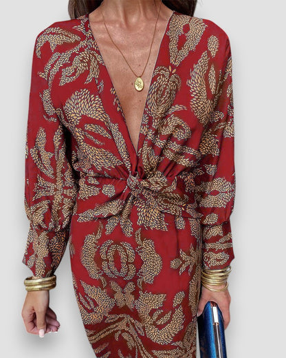 Red V-neck long-sleeve dress with knot-tie waist and leaf pattern