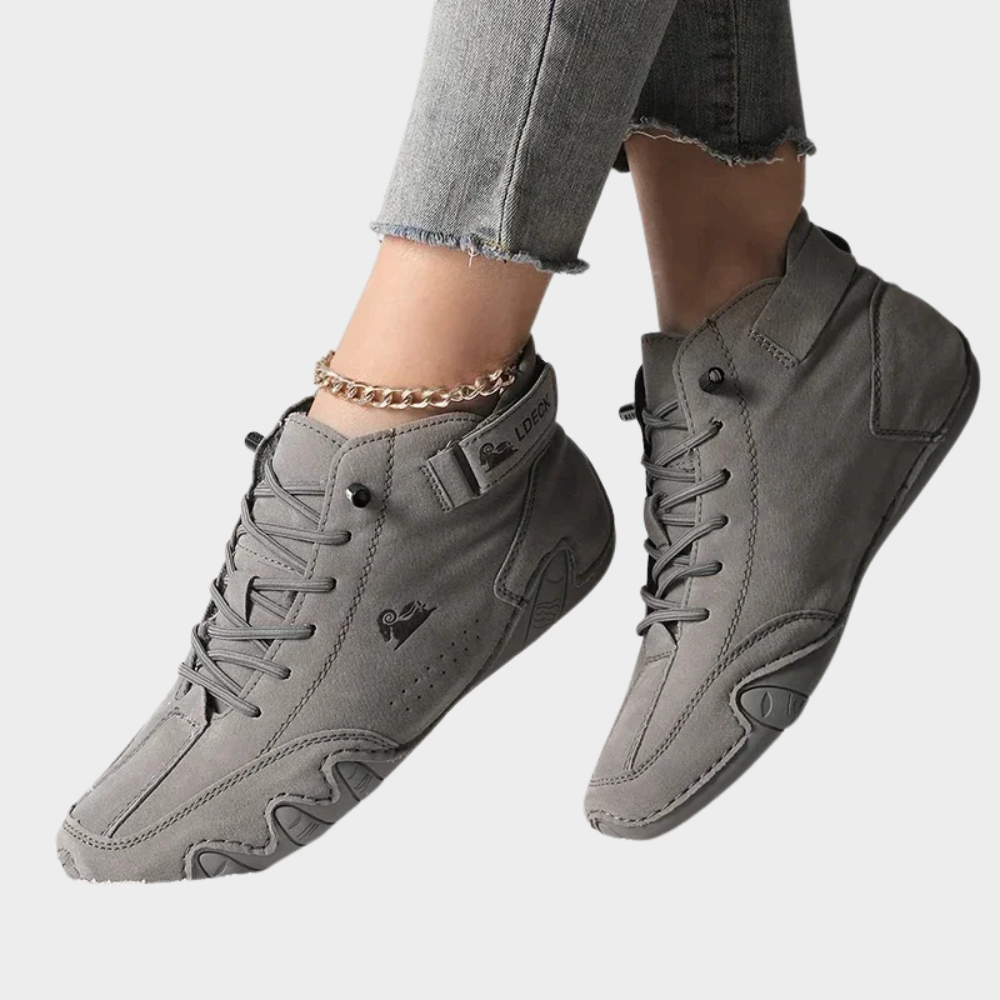 Light gray orthopedic ankle boots with lace-up closure, padded collar, chunky sole