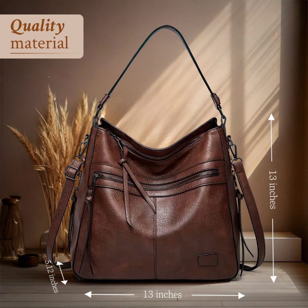 Brown hobo shoulder bag with front zip pockets and two shoulder straps