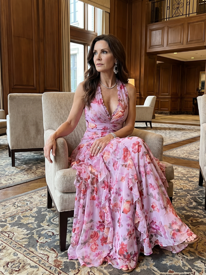 Pink floral maxi dress with halter neckline, ruched bodice and cascading ruffle skirt