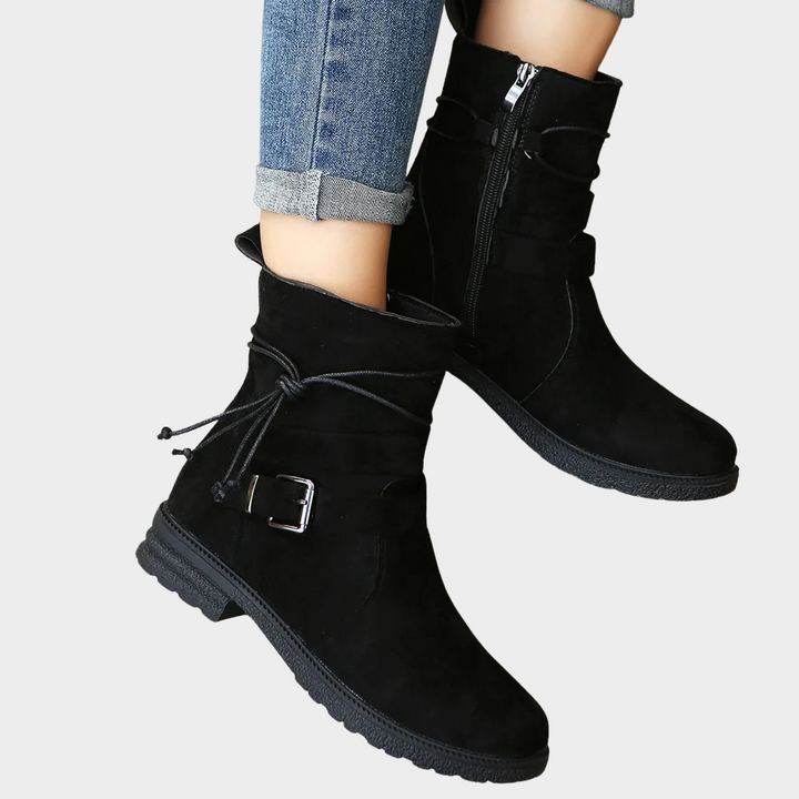 Black suede low-heel ankle boots with side zipper and front buckle strap