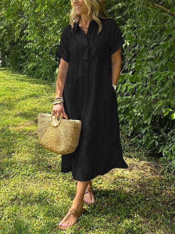 Black striped button-up dress with short sleeves and gathered waist.