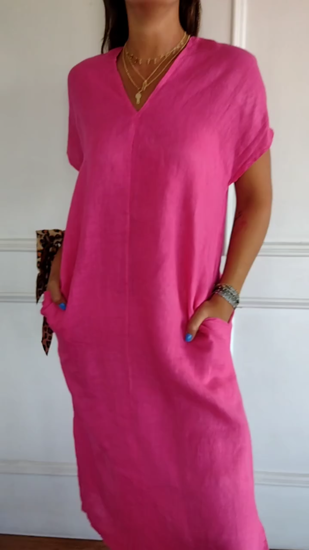Pink tummy-flattering dress with V-neck and short sleeves, side slit