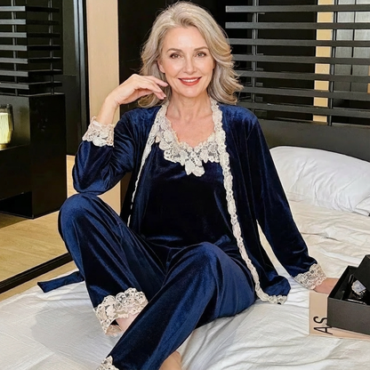 Women’s navy-blue velvet sleepwear set with lace-trim camisole, robe, and ankle pants