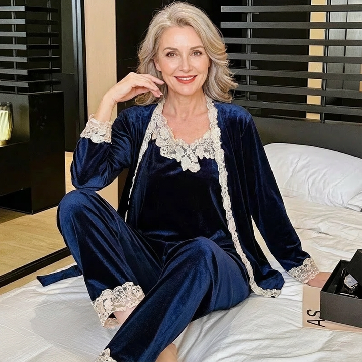 Women’s navy-blue velvet sleepwear set with lace-trim camisole, robe, and ankle pants