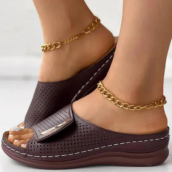 Perforated slide sandals in dark purple with wide toe strap and cushioned sole