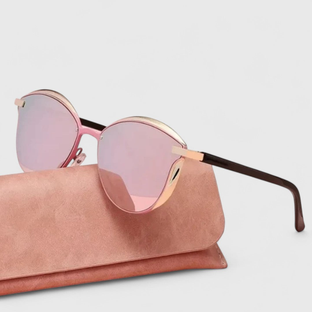 Pink mirrored sunglasses with rose frame and gold bridge, featuring round lenses