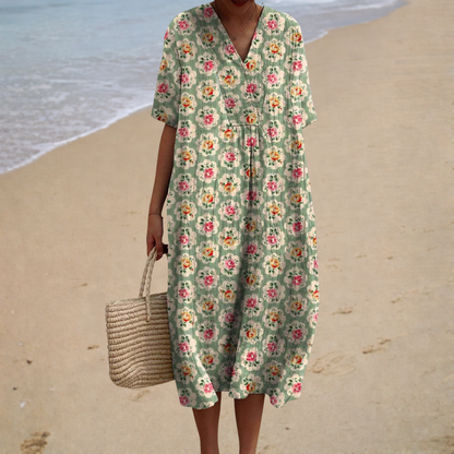 Floral summer dress in sage green with V-neck, gathered waist and short sleeves