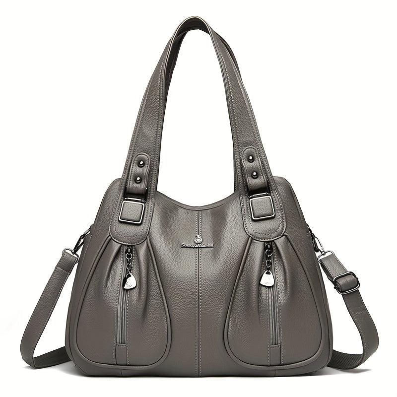 Women’s casual shoulder bag in grey with top handles and crossbody strap.