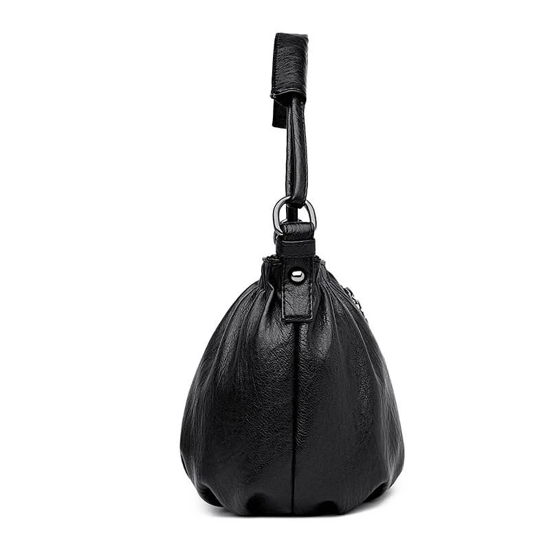 Black multi-layer handbag bottom view with short loop handle and gathered body shape