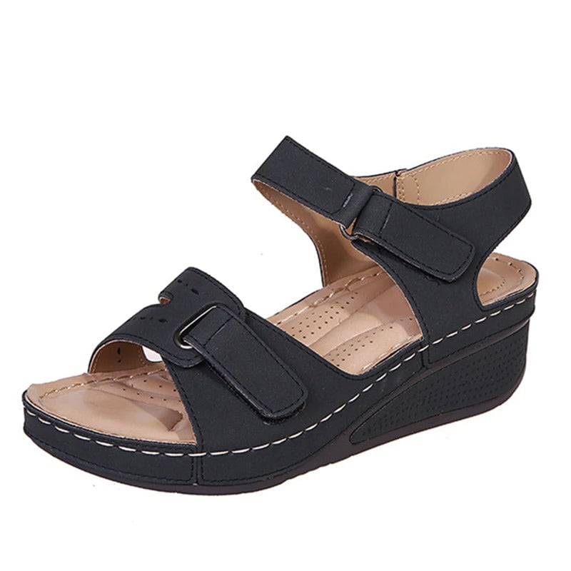 Women’s black wedge sandals with two adjustable straps and perforated footbed