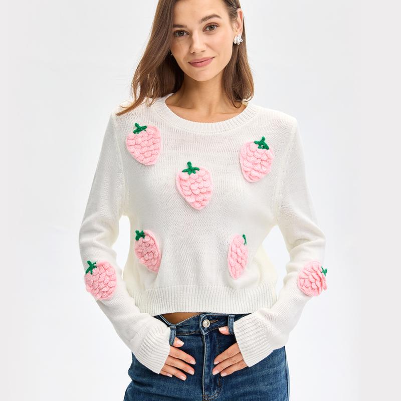 White long sleeve sweater with pink strawberry appliques and green leaves