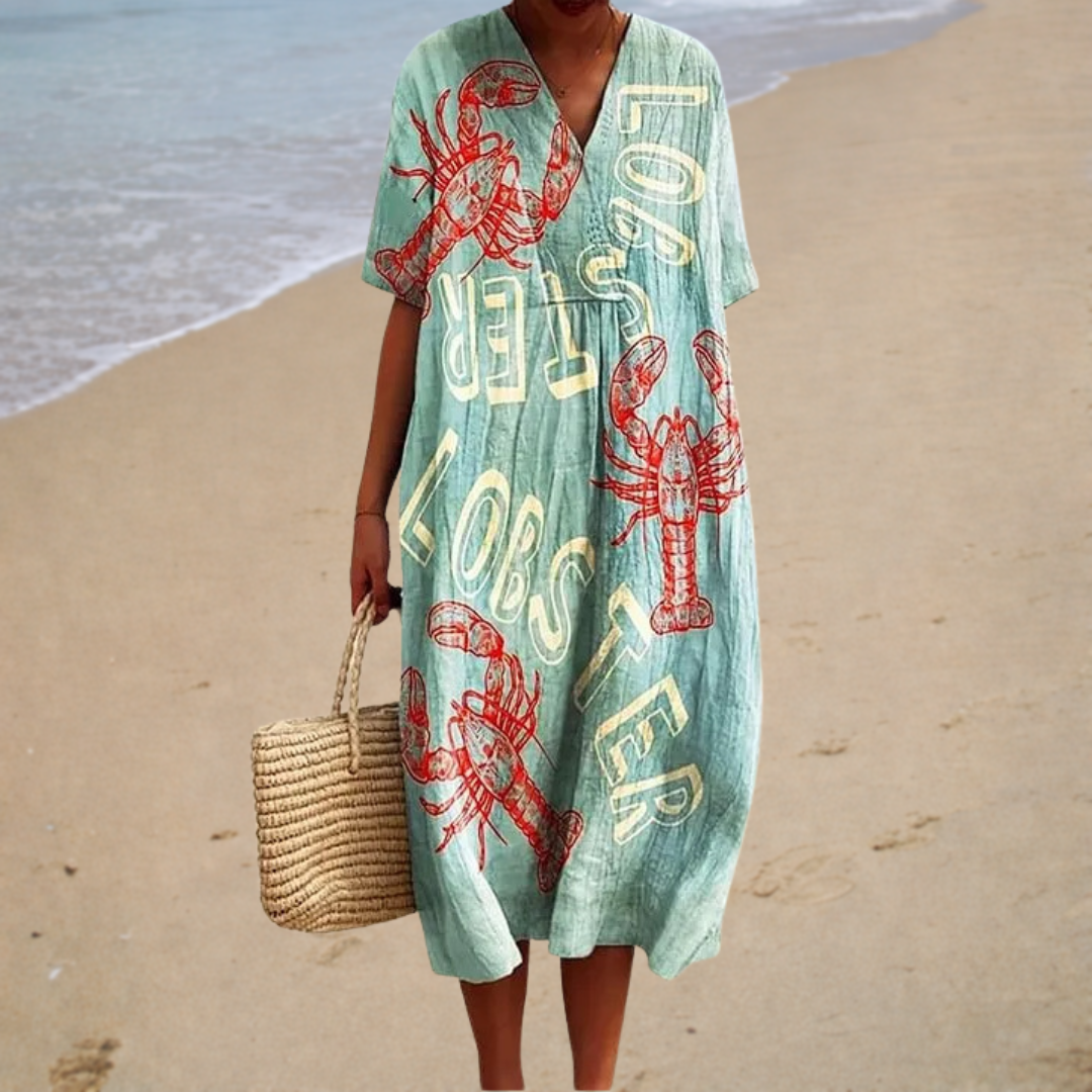 Light green summer dress with V-neck, short sleeves, and red graphic print