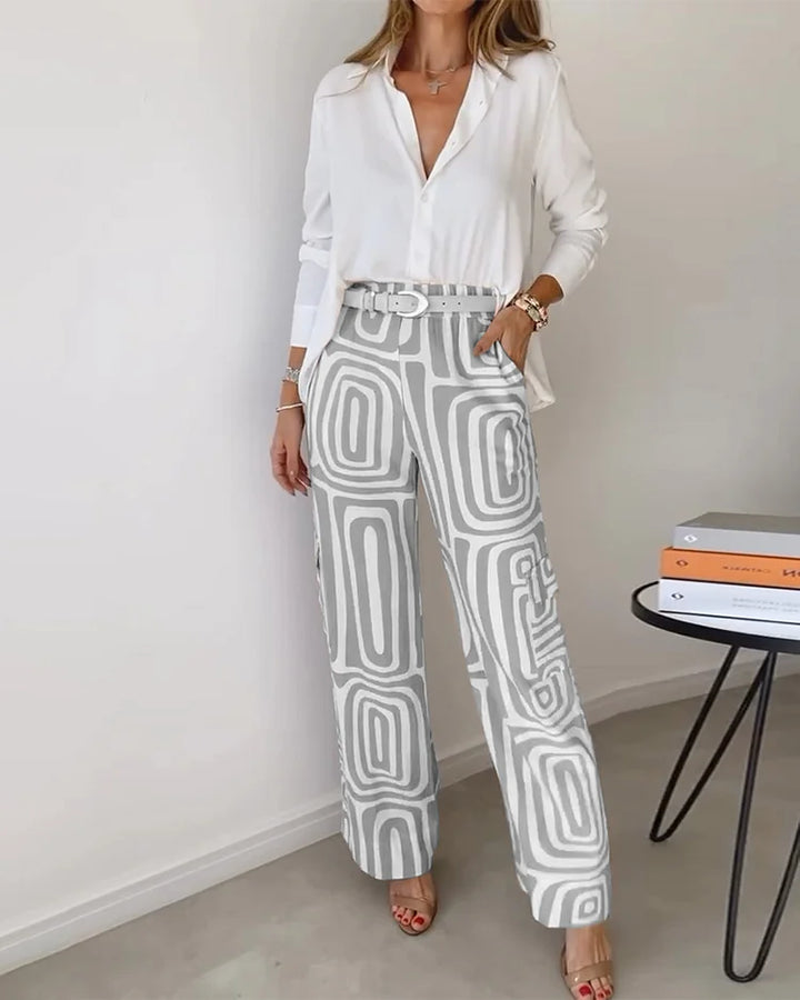 Two-piece set with white button-front blouse and grey abstract-pattern trousers with belt