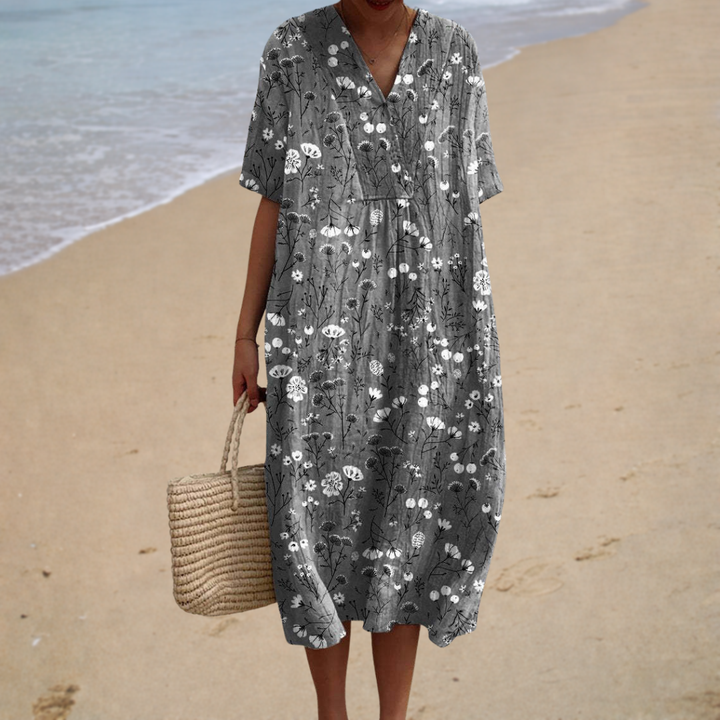 Floral summer dress in dark gray with white V-neck, short sleeves, and relaxed fit