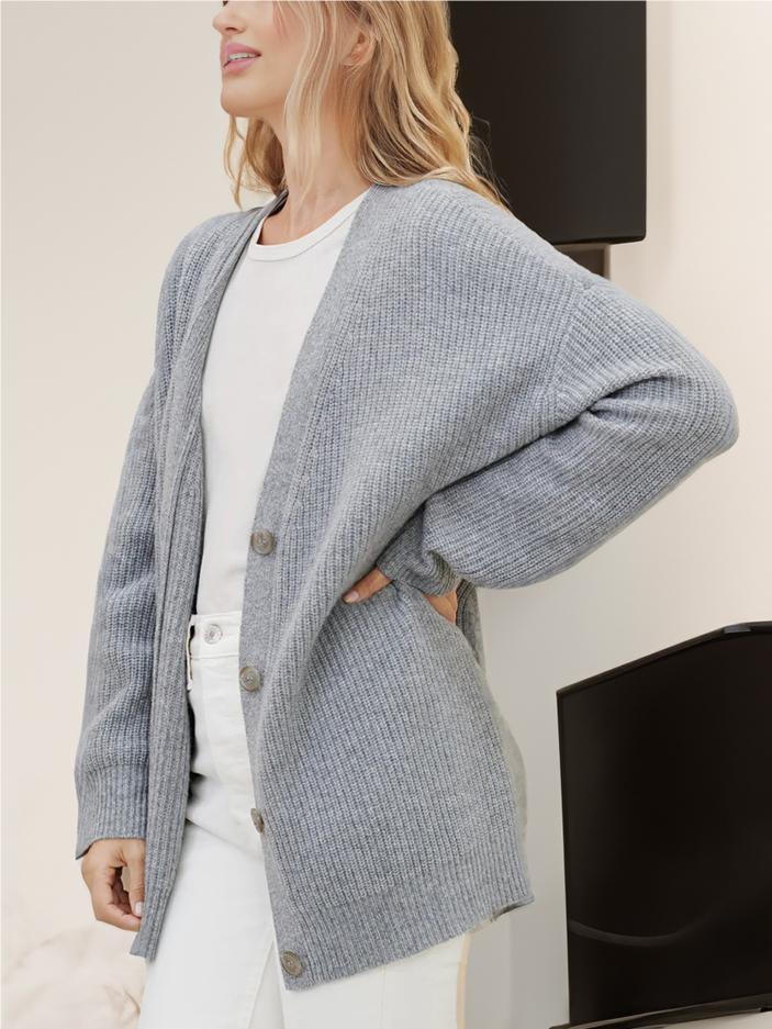 Gray knit cardigan, V-neck button front, relaxed cocoon silhouette, long sleeves, ribbed hem.