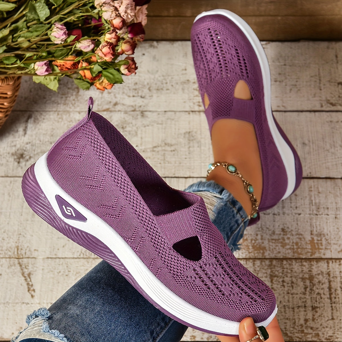 Purple knit slip-on orthopedic shoes with side cutouts and white sole