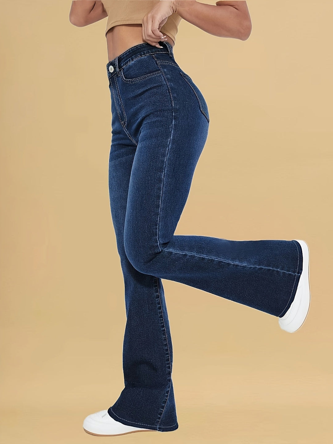 Dark blue flare jeans with high rise, front pockets, and button waist