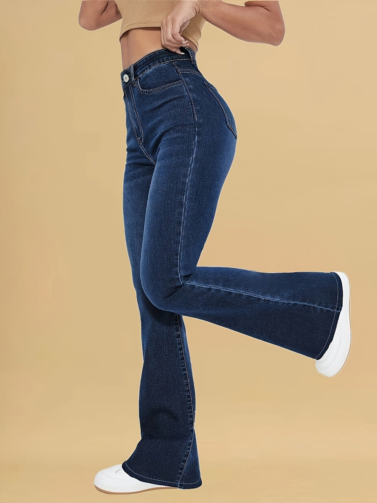 Dark blue flare jeans with high rise, front pockets, and button waist