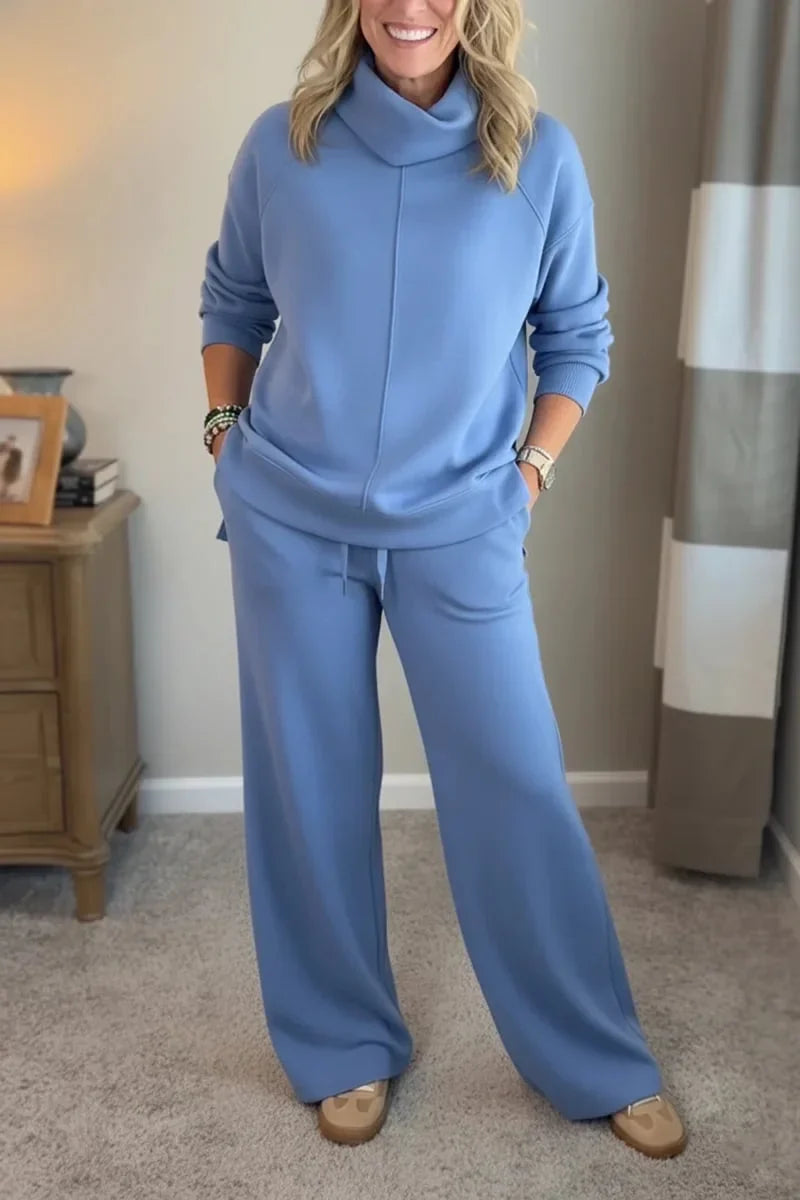 Blue coordinated zip-front hoodie top and wide-leg pants set.
