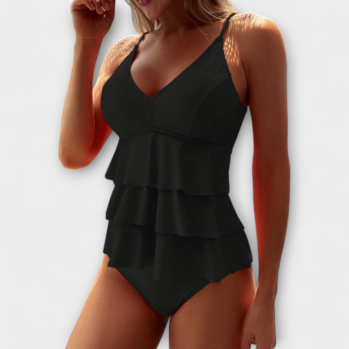 Black ruffle swim tank with V-neck and layered peplum, matching briefs
