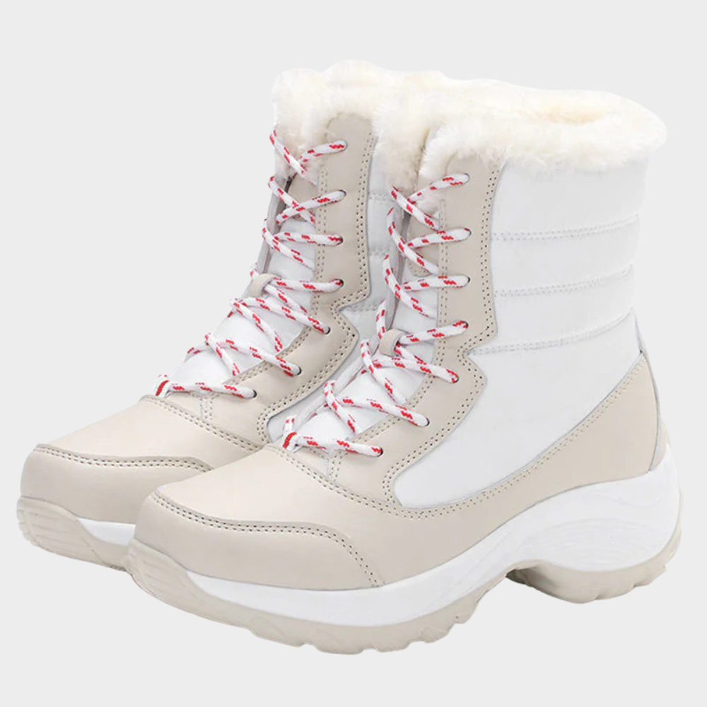 White-and-cream winter boots with lace-up front, red laces, and faux-fur collar.