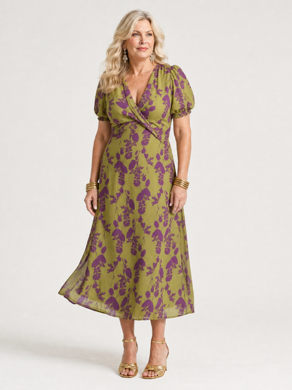 Floral midi dress with V-neck wrap bodice, short puff sleeves, and flowing skirt