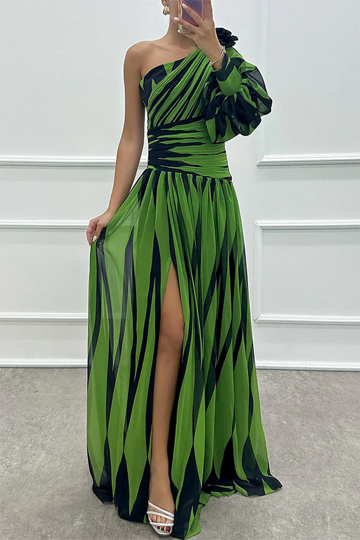 One-shoulder maxi dress in green with dark stripes, pleated skirt, side slit