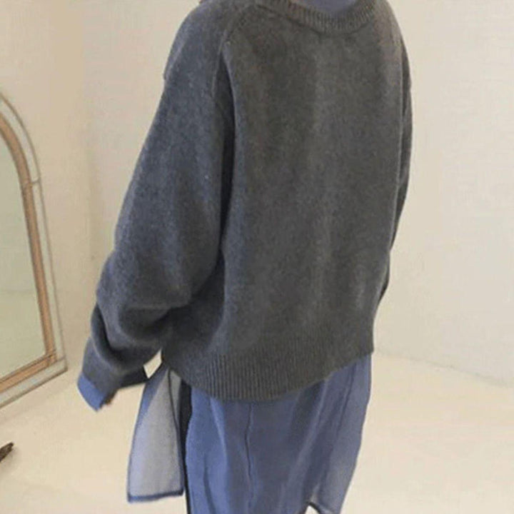 Gray asymmetric button cardigan back view with ribbed crewneck and hem