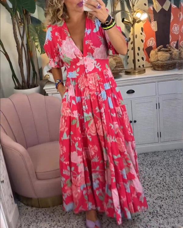 Floral maxi dress with red background, pink blossoms and blue accents, V-neck, tiered hem
