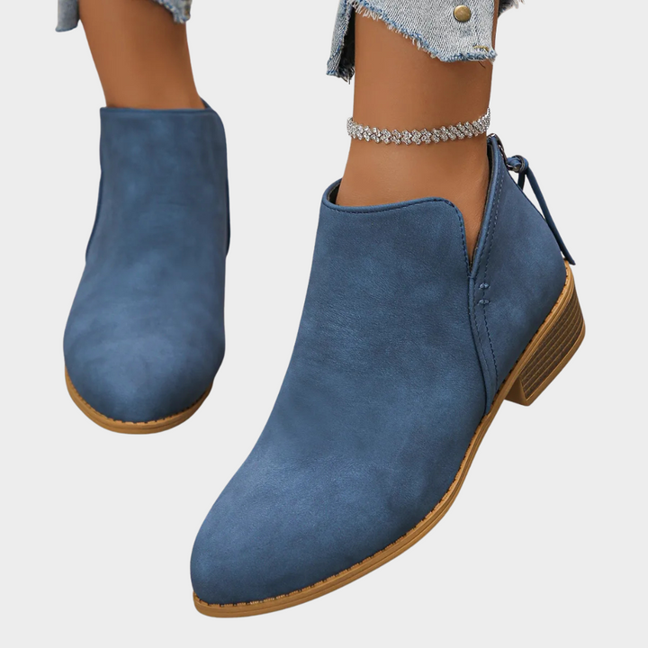 Blue suede low-heel ankle boot with side tie and tan rubber sole
