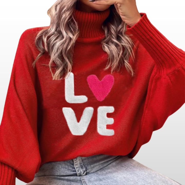 Red knit turtleneck sweater with batwing sleeves and “LOVE” graphic with heart