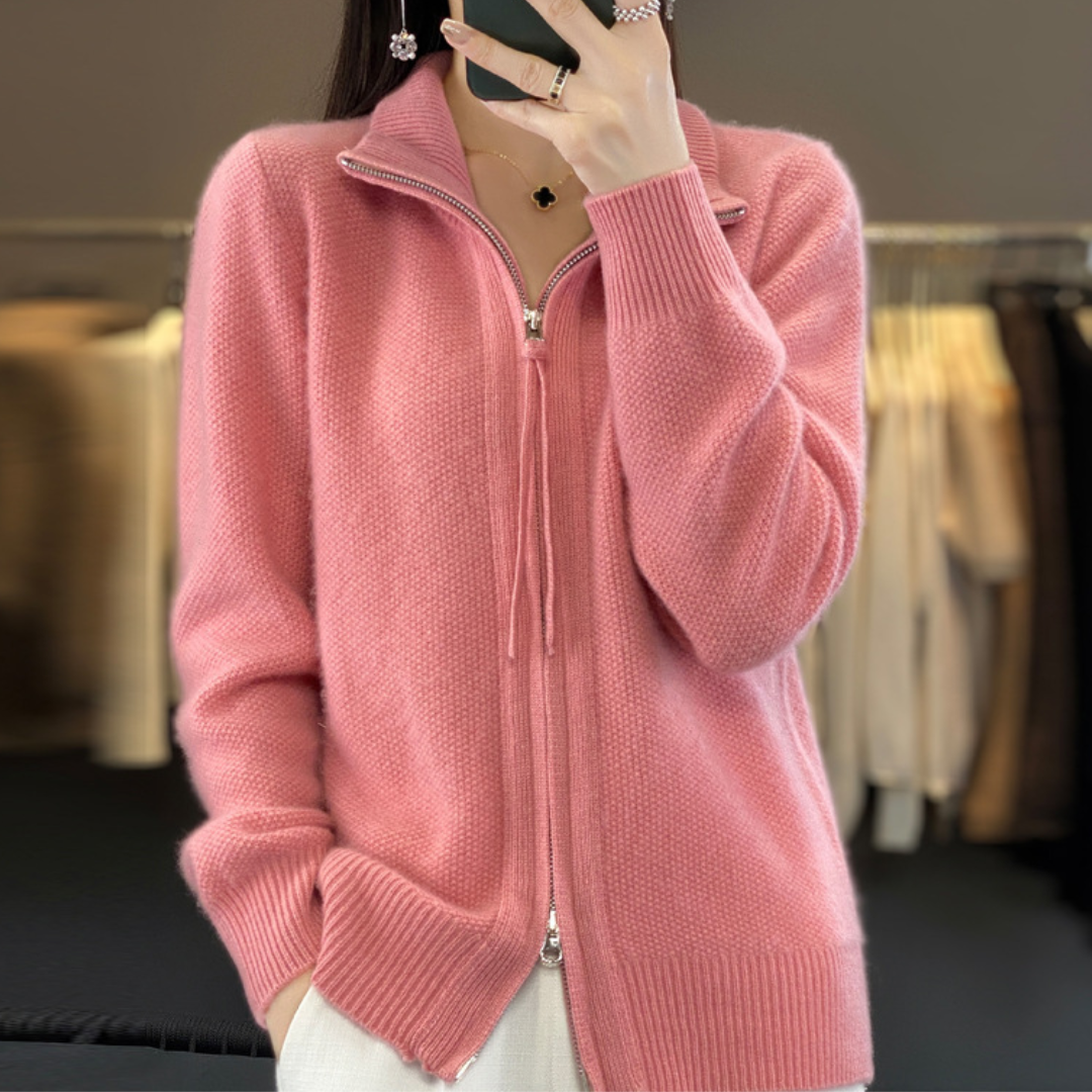 Pink zip-up knit sweater with stand collar and ribbed cuffs