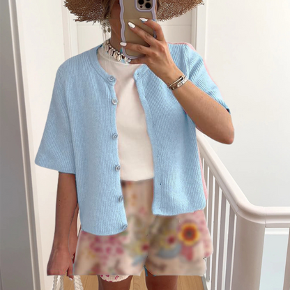 Light blue short-sleeve button-front knit cardigan with ribbed texture and rounded collar.