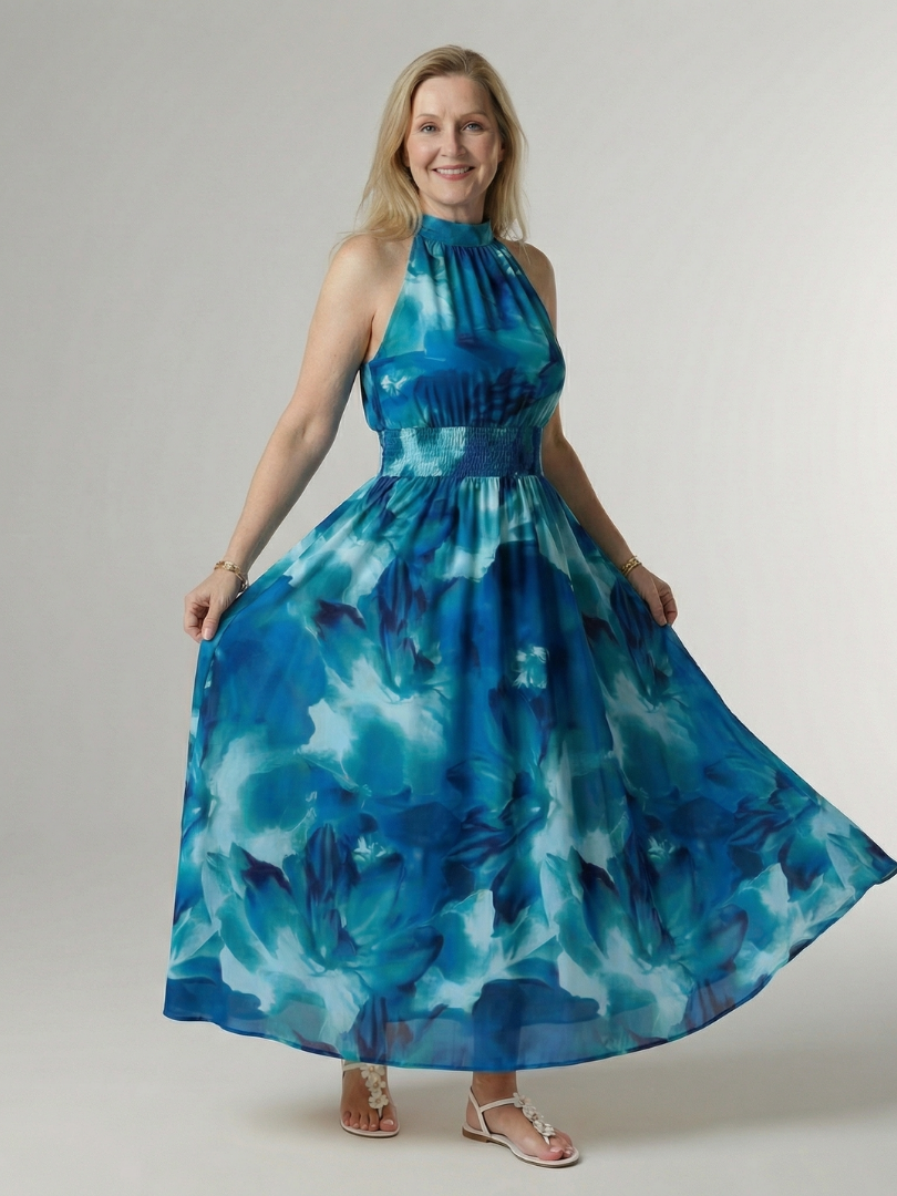 Blue gathered halter midi dress with smocked waist and flowing tie-dye skirt