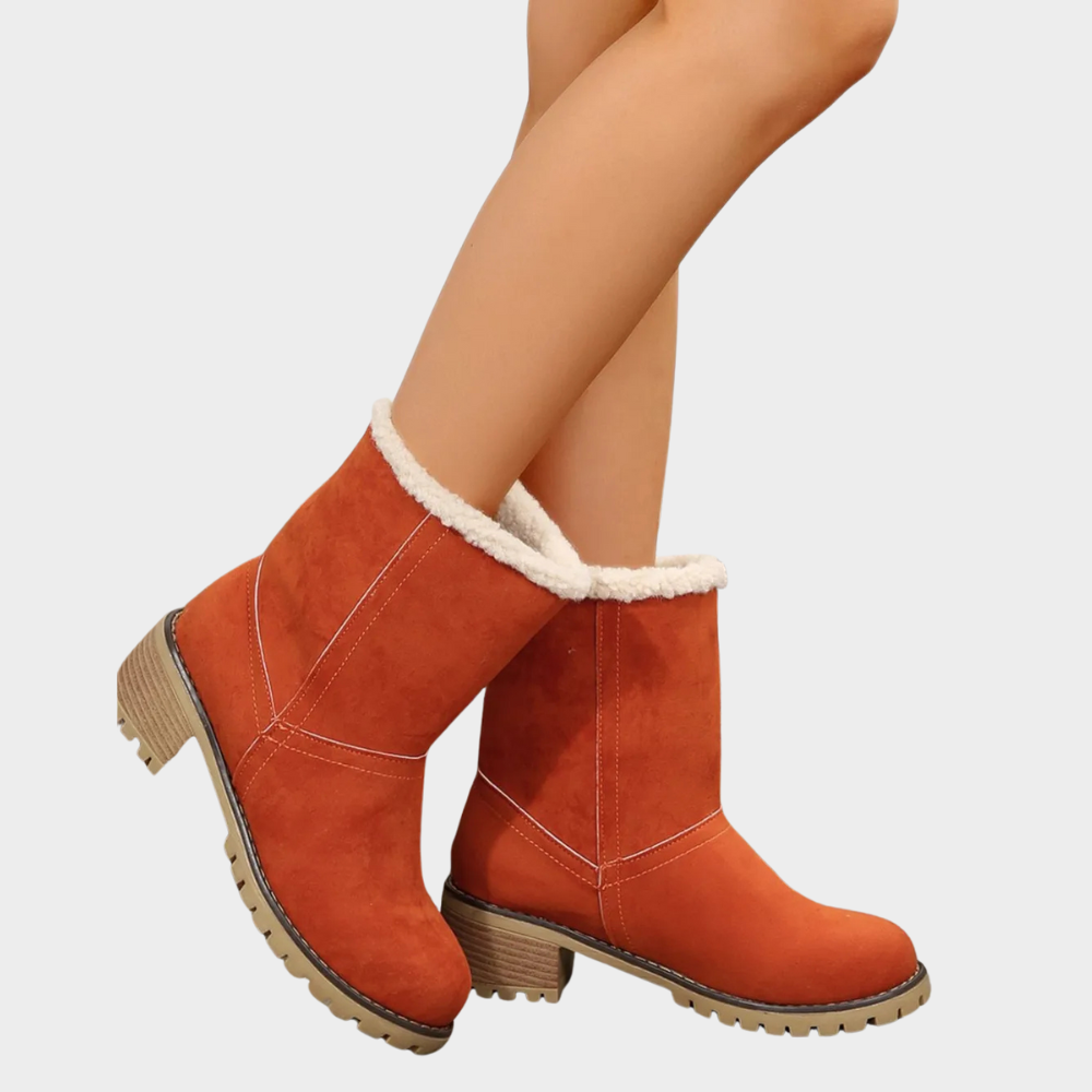 Orange suede winter boots with faux-sherpa trim, ankle height, and chunky lug sole