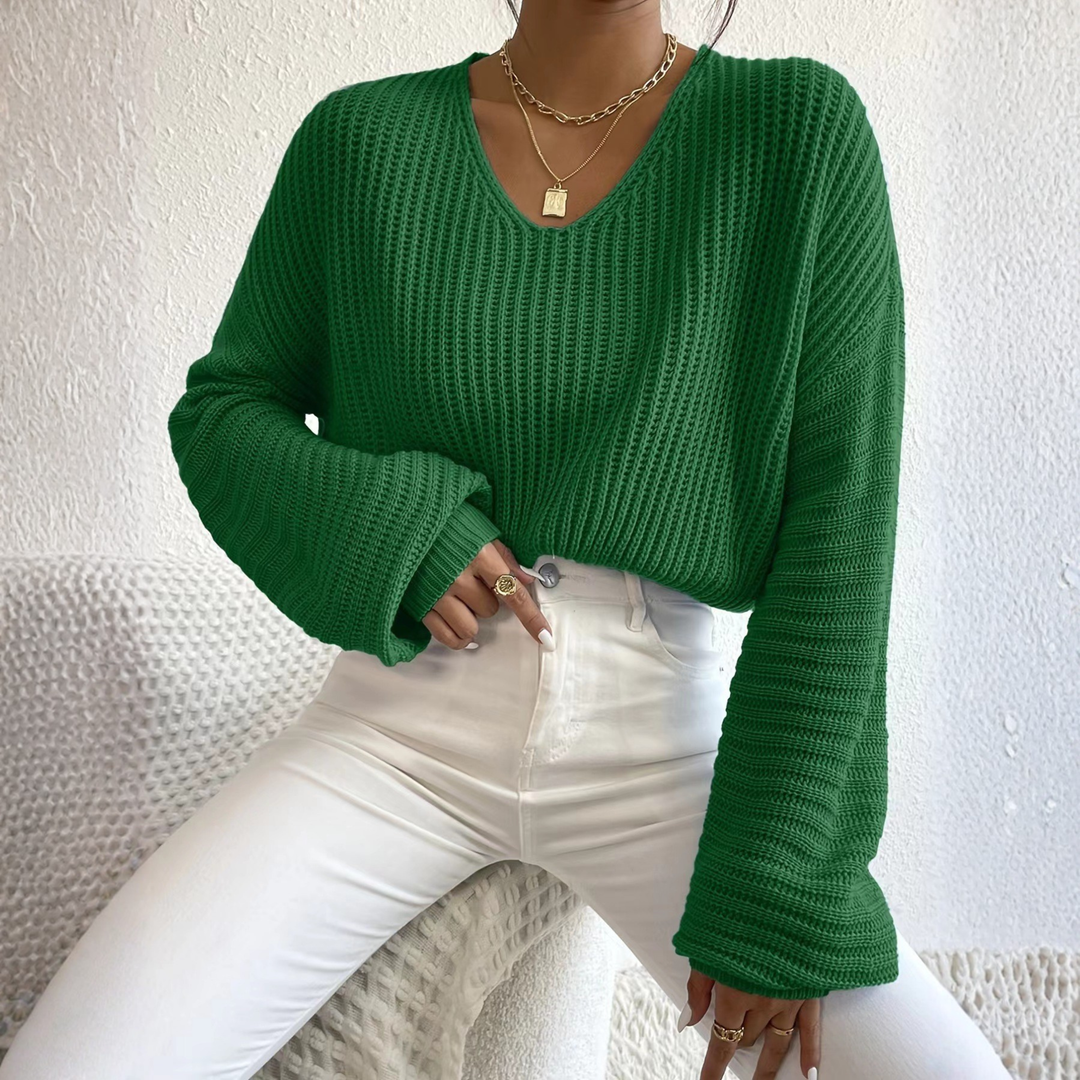 Green knit V-neck long-sleeve sweater with ribbed cuffs and textured stitch